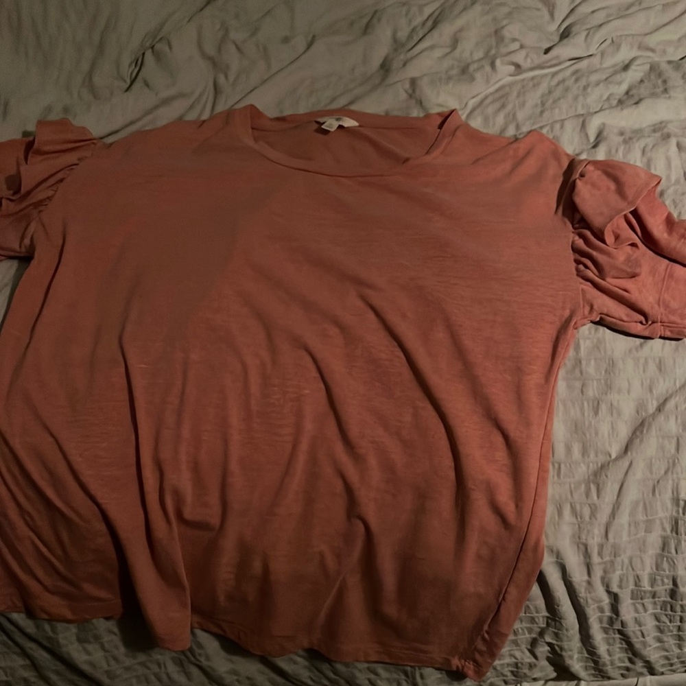 An orange color top, size xl